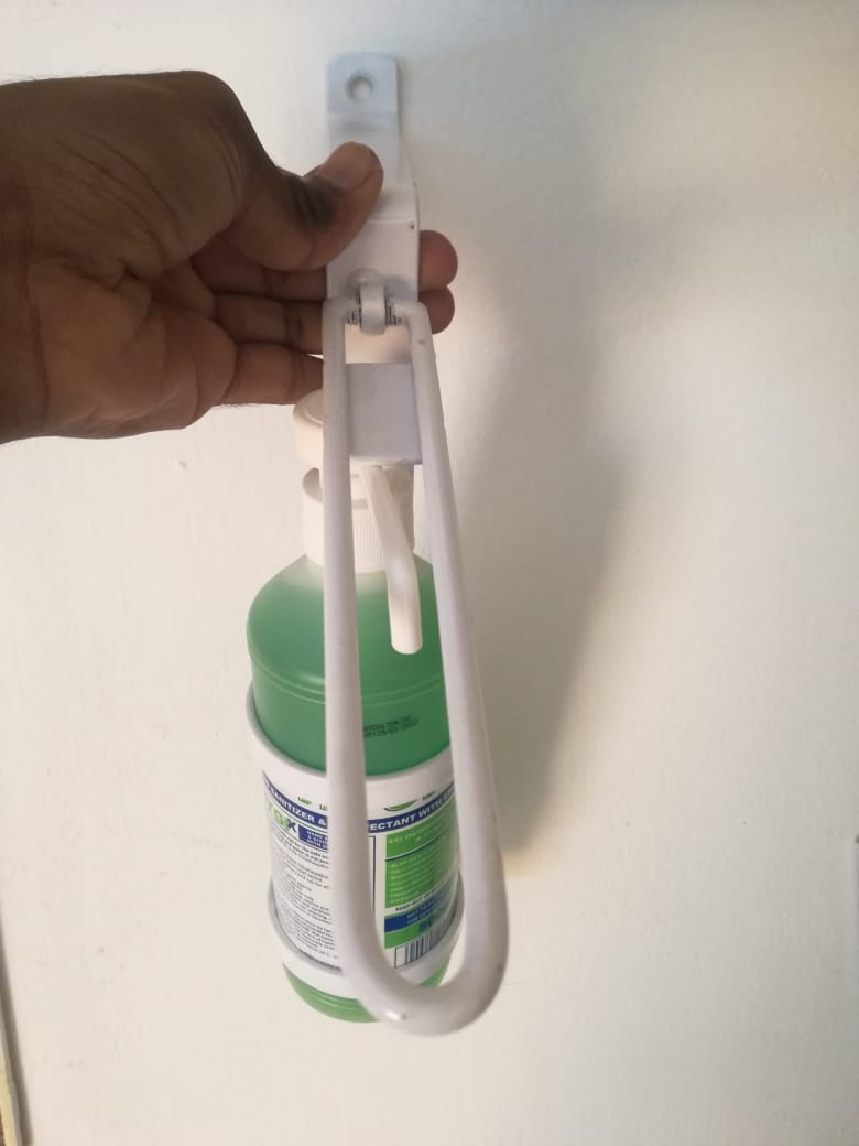 Sanitiser bottle wall holder